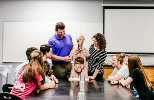 Students in classroom learning about anatomy with Dr. John Murphy